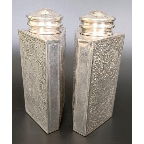 123 - A pair of Continental silver coloured metal triangular caddies, engraved foliate forms and birds, 12... 