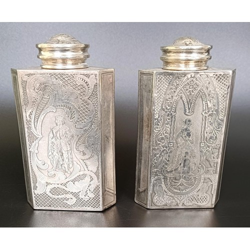 123 - A pair of Continental silver coloured metal triangular caddies, engraved foliate forms and birds, 12... 