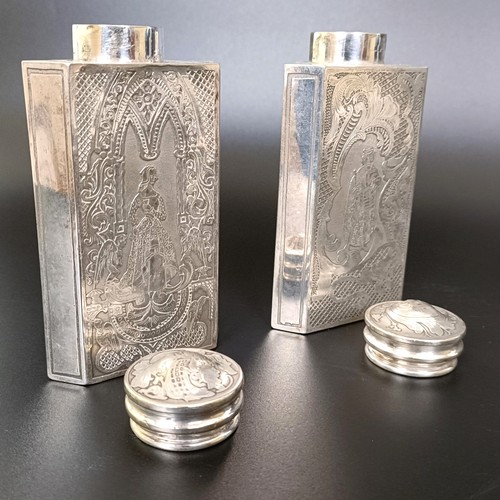 123 - A pair of Continental silver coloured metal triangular caddies, engraved foliate forms and birds, 12... 