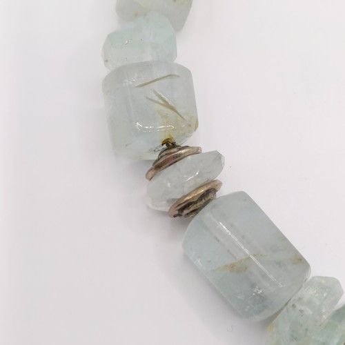 825 - A 20th century aquamarine natural crystal form bead necklace, with silver coloured metal mounts