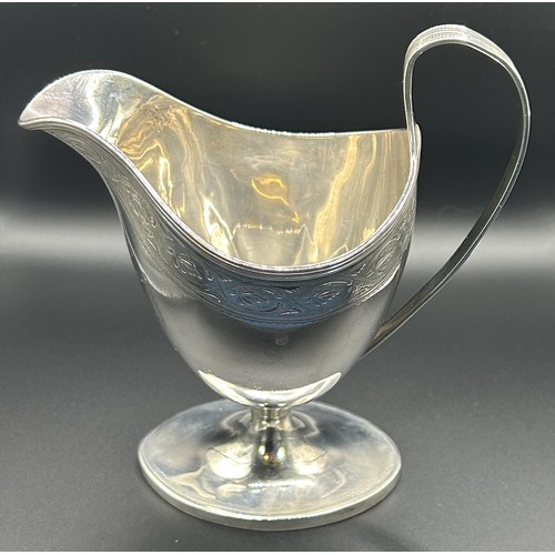 134 - A George IV Scottish silver cream jug, monogrammed, Edinburgh 1820, 6.3 ozt, 15 cm high