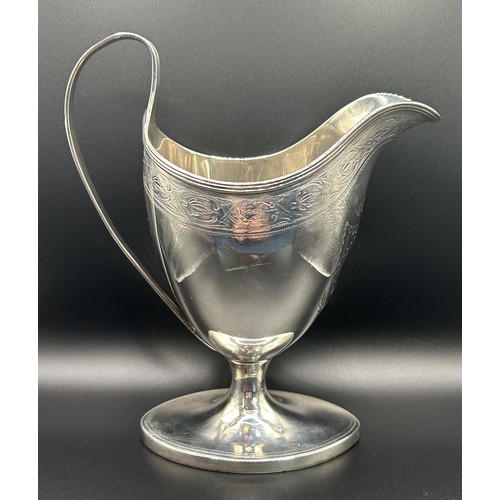 134 - A George IV Scottish silver cream jug, monogrammed, Edinburgh 1820, 6.3 ozt, 15 cm high