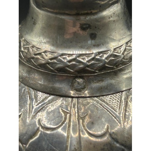 139 - A Dutch silver coloured metal table bell, with engraved decoration, 17 cm high