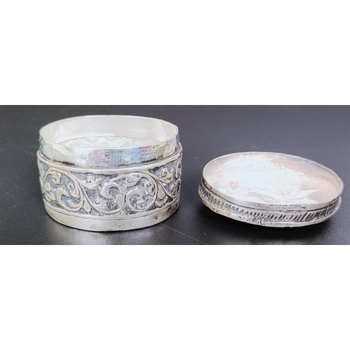 175 - An Eastern silver coloured metal box, an Old English pattern sifting spoon, two boxes, two spoons an... 