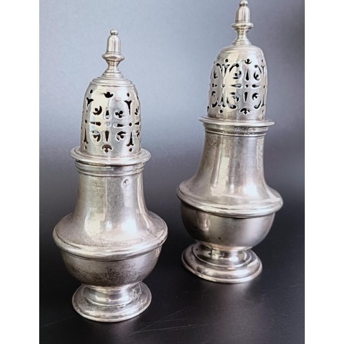 177 - An early 19th century silver caster, marks rubbed, 13 cm high, and another similar, 10 cm high, 6.6 ... 