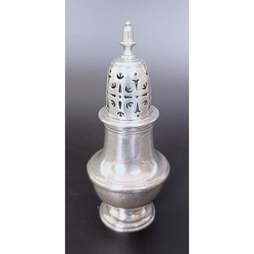 177 - An early 19th century silver caster, marks rubbed, 13 cm high, and another similar, 10 cm high, 6.6 ... 