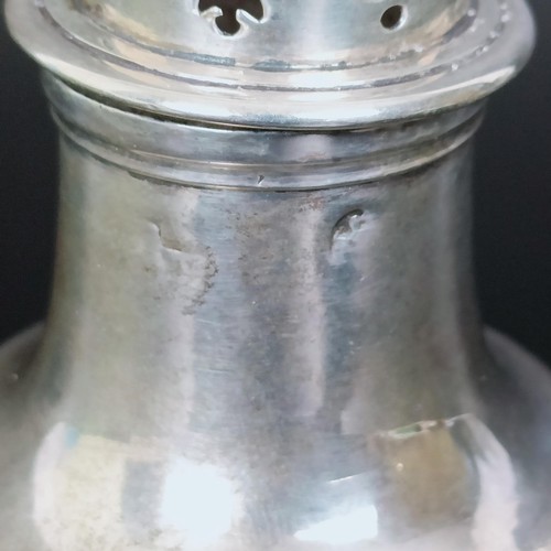 177 - An early 19th century silver caster, marks rubbed, 13 cm high, and another similar, 10 cm high, 6.6 ... 