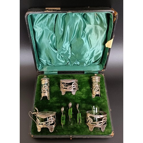 158 - A late Victorian Art Nouveau silver five piece cruet, comprising a pair of salts, a mustard pot and ... 