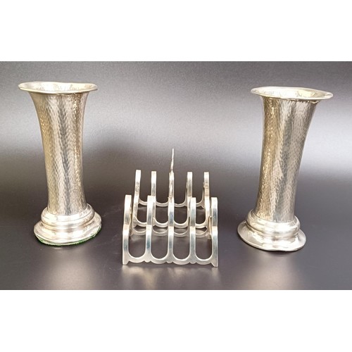 163 - A pair of George V silver four section toast racks, 2.1 ozt, and a pair of silver vases, bases fille... 