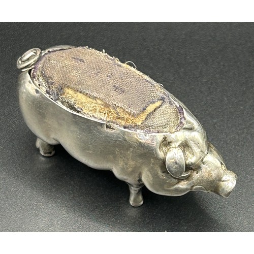 197 - An Edward VII novelty silver pig pin cushion, Birmingham 1904, 3 cm high