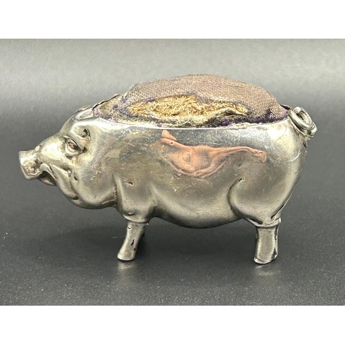 197 - An Edward VII novelty silver pig pin cushion, Birmingham 1904, 3 cm high