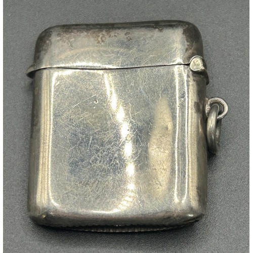 212 - A George V silver vesta case, applied a tennis racket and ball, Birmingham 1919, 24.5 g, 4.5 cm high