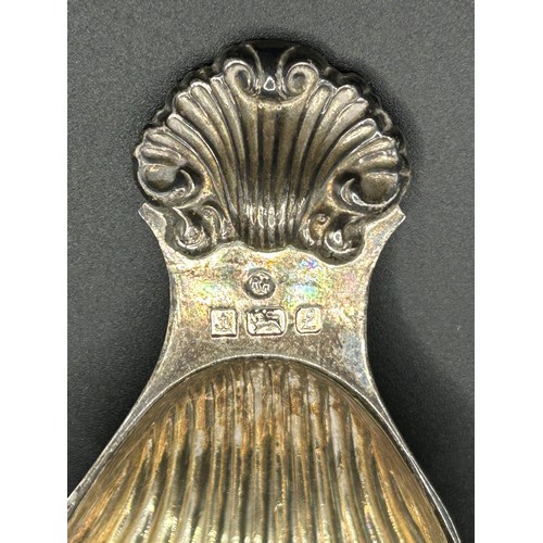 221 - An Elizabeth II silver caddy spoon, with fluted bowl, Birmingham 1985, 21.3 g