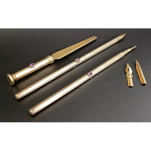 348 - An Edward VII Arts & Crafts silver and amethyst pen set, comprising a pen, letter opener and pro... 