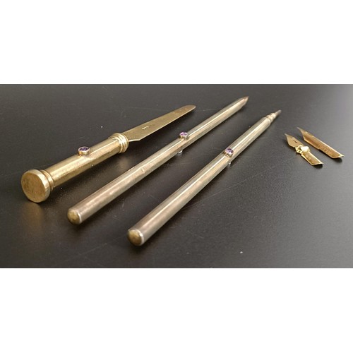 348 - An Edward VII Arts & Crafts silver and amethyst pen set, comprising a pen, letter opener and pro... 
