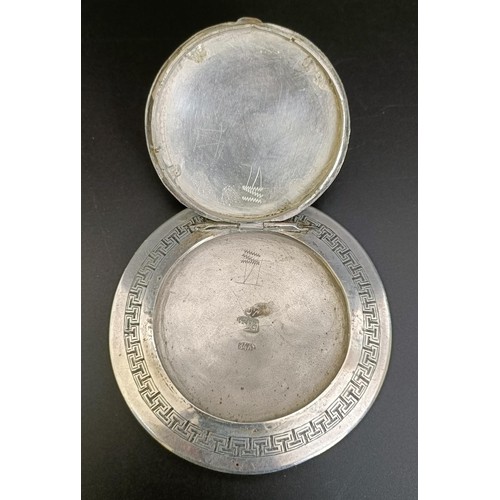 363 - An Iraqi silver coloured metal compact, with niello decoration, 9 cm diameter