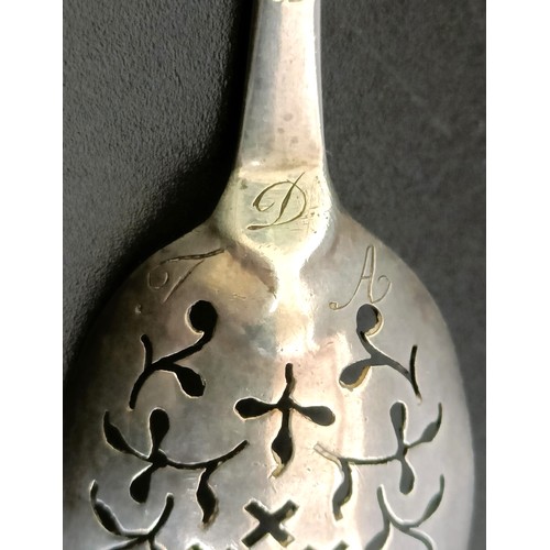 366 - An 18th century silver mote spoon, marks rubbed, and another (2)