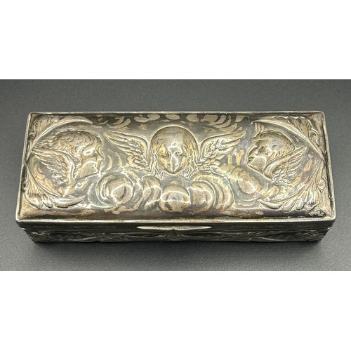 239 - A Victorian silver box, inscribed, embossed with cherubs, London 1896, 2.6 ozt, 11 cm wide