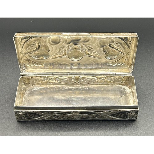 239 - A Victorian silver box, inscribed, embossed with cherubs, London 1896, 2.6 ozt, 11 cm wide