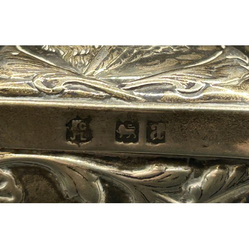 239 - A Victorian silver box, inscribed, embossed with cherubs, London 1896, 2.6 ozt, 11 cm wide