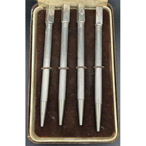 247 - A set of four sterling silver bridge pencils, cased