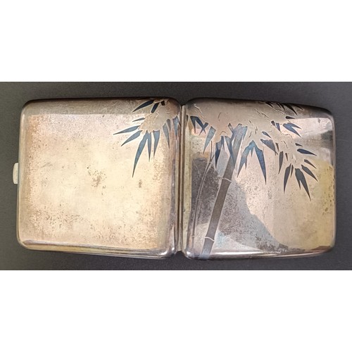 377 - An Eastern silver coloured metal cigarette case, cased