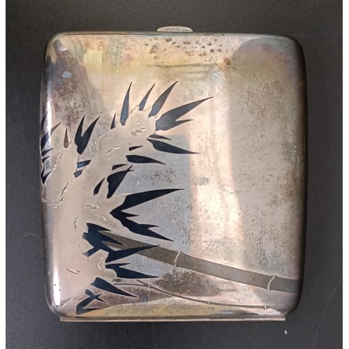 377 - An Eastern silver coloured metal cigarette case, cased