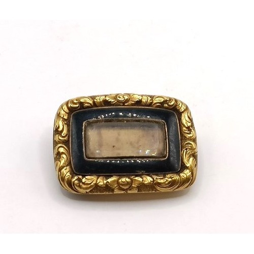 601 - A 19th century yellow metal and black enamel memorial broochProvenance:  Sold on behalf of Dorset Wi... 