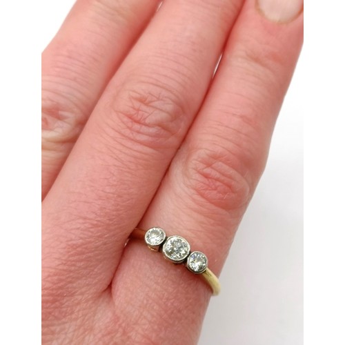 602 - A three stone diamond ring, ring size NProvenance:  Sold on behalf of Dorset Wildlife Trust