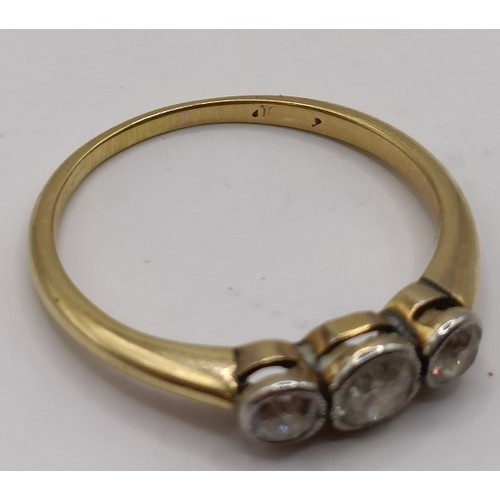 602 - A three stone diamond ring, ring size NProvenance:  Sold on behalf of Dorset Wildlife Trust