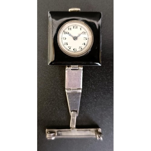 911 - A ladies Art Deco silver paste and black enamel watch