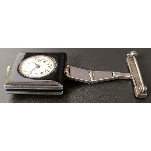 911 - A ladies Art Deco silver paste and black enamel watch