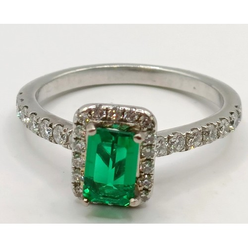 617 - An 18ct white gold, diamond and emerald cluster ring, ring size J