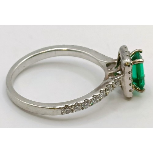 617 - An 18ct white gold, diamond and emerald cluster ring, ring size J