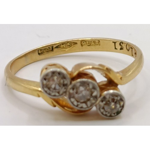 619 - An 18ct gold and three stone diamond ring, ring size J Provenance:  Sold on behalf of Dorset Wildlif... 