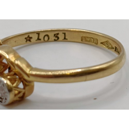 619 - An 18ct gold and three stone diamond ring, ring size J Provenance:  Sold on behalf of Dorset Wildlif... 