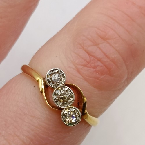 619 - An 18ct gold and three stone diamond ring, ring size J Provenance:  Sold on behalf of Dorset Wildlif... 