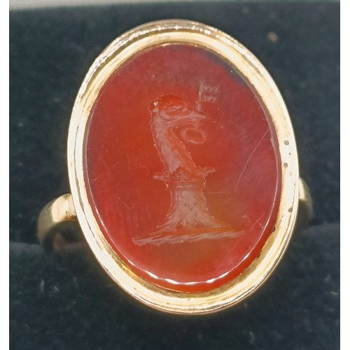 635 - An 18ct gold and carnelian intaglio ring, ring size J