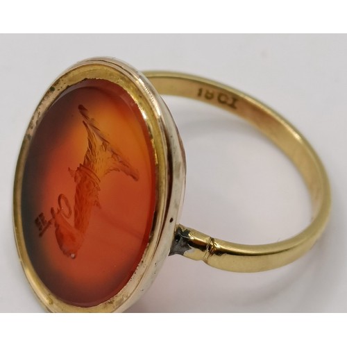 635 - An 18ct gold and carnelian intaglio ring, ring size J