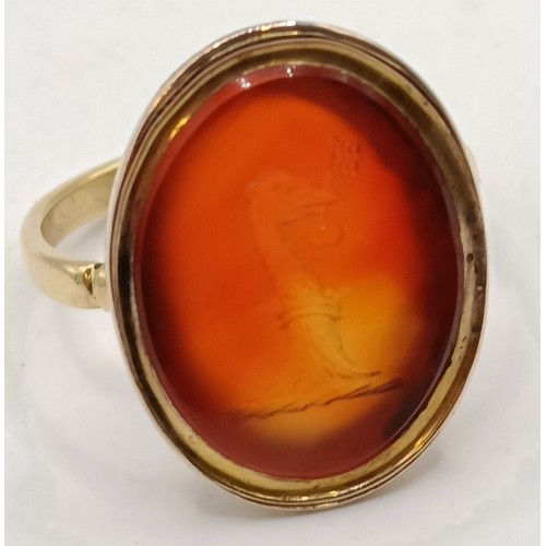 635 - An 18ct gold and carnelian intaglio ring, ring size J