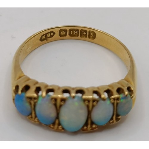 648 - An 18ct gold and opal ring, ring size M, and an opal brooch (2)Provenance:  Sold on behalf of Dorset... 