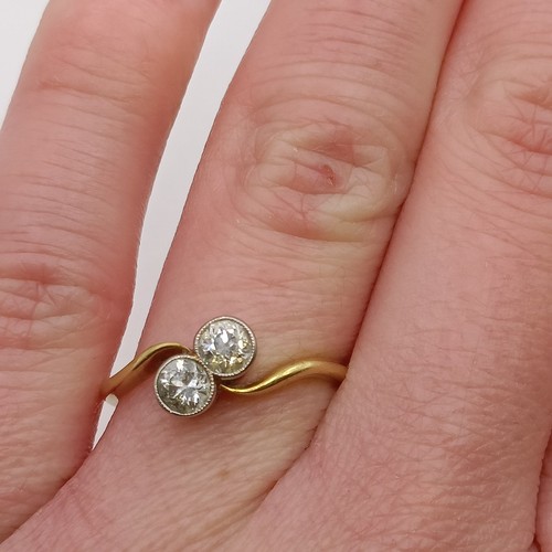 650 - An 18ct gold and diamond cross over ring, ring size K Provenance:  Sold on behalf of Dorset Wildlife... 