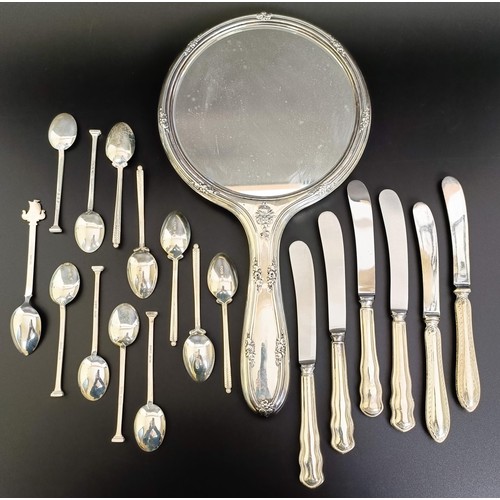 385 - Assorted silver teaspoons, 3.4 ozt, silver handled fruit knives, and a silver backed mirror, various... 