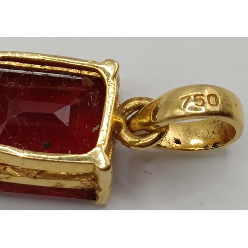 663 - An 18ct gold and ruby pendant