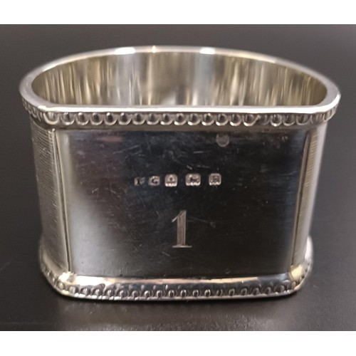 258 - A silver cigarette case, two silver vestas, and four napkin rings, 9.7 ozt (7)