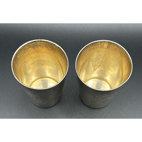 259 - A pair of Continental silver coloured metal stacking cups, 5 cm high (2)