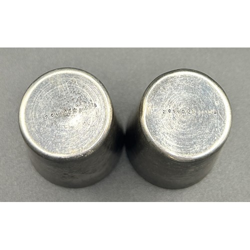 259 - A pair of Continental silver coloured metal stacking cups, 5 cm high (2)