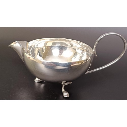 263 - A George V cream jug, a four section silver toast rack, a pair of sugar nips and a fish knife, vario... 