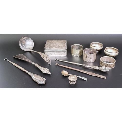 266 - A George V silver box, with a wooden lining, three napkin rings, a ladle, and assorted other items