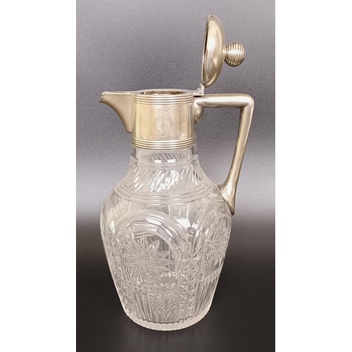 408 - An Austrian cut glass claret jug, with silver mount and handle, 25 cm high